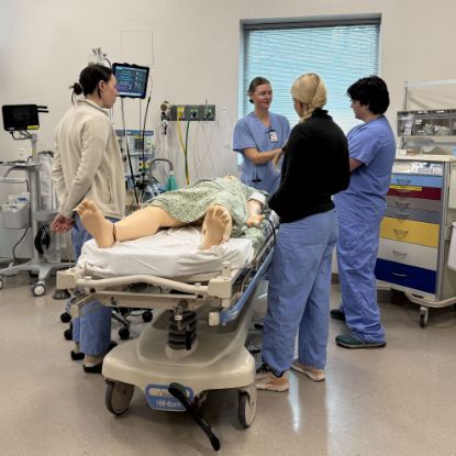 Medical students learning a procedure at the Center for Patient Simulation