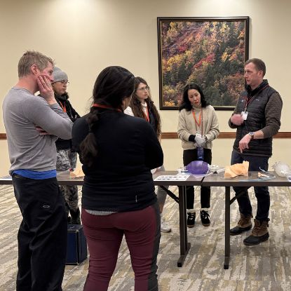 An instructor teaching an emergency airway workshop. 