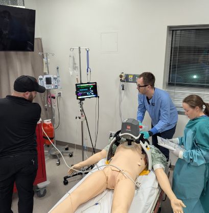 0	Three doctors practicing crisis resource management in the Center for Patient Simulation.